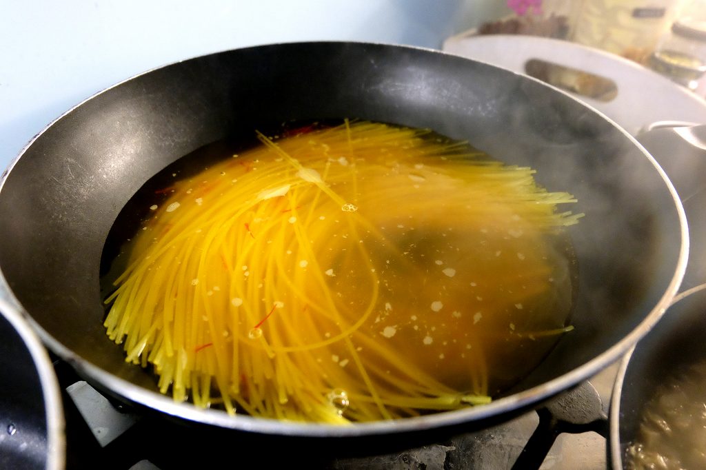 Pasta cooking in a pan