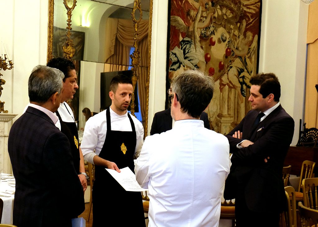 Chefs talking in dining room