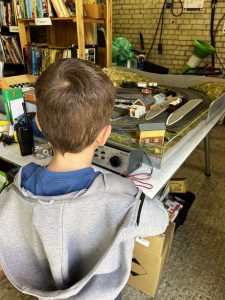 Child looking at model trains